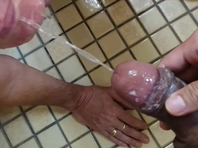 Asian twink gets pissed and cums with big black cock